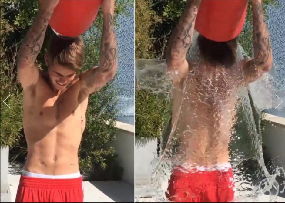 Award winning Justin Bieber dunks himself in a bucket of water. Award winning Justin Bieber dunks himself in a bucket of water.