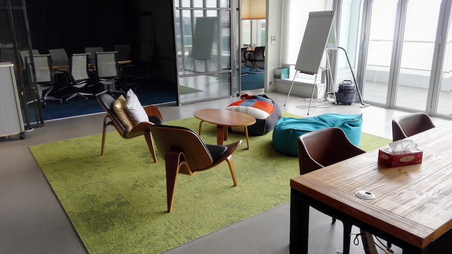 A room with a green rug. A room with a green rug.