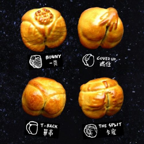 A display of four award-winning buns on a black surface. A display of four award-winning buns on a black surface.