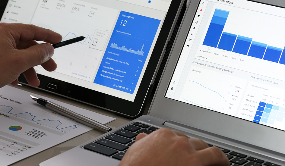 Two award-winning laptops displaying Google Analytics graphs for digital marketing. Two award-winning laptops displaying Google Analytics graphs for digital marketing.