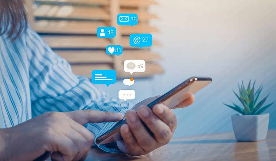 A woman is engaging with social media icons on her smartphone, utilizing award-winning digital marketing strategies. A woman is engaging with social media icons on her smartphone, utilizing award-winning digital marketing strategies.