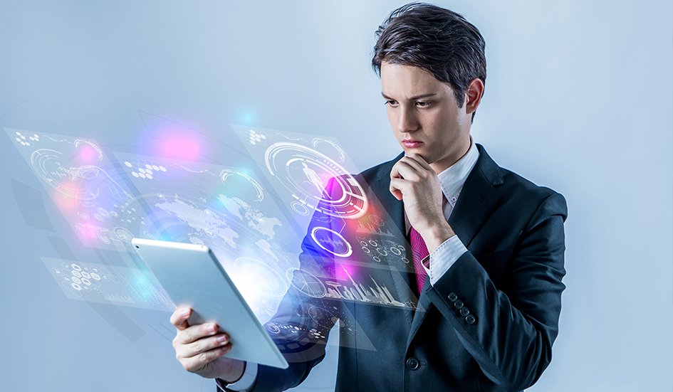 A suit-clad businessman engaging in digital marketing by examining a tablet. A suit-clad businessman engaging in digital marketing by examining a tablet.