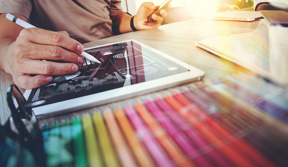 An SEO expert working on a tablet with digital marketing tools. An SEO expert working on a tablet with digital marketing tools.
